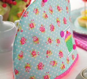 Cotton print and cross-stitch tea cosy