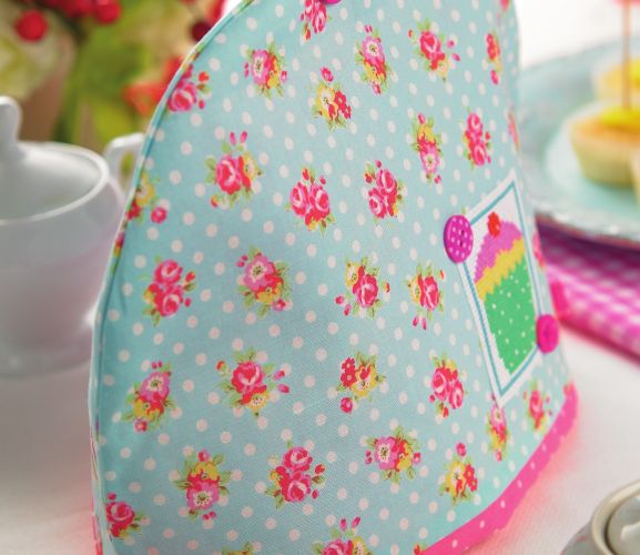 Cotton print and cross-stitch tea cosy